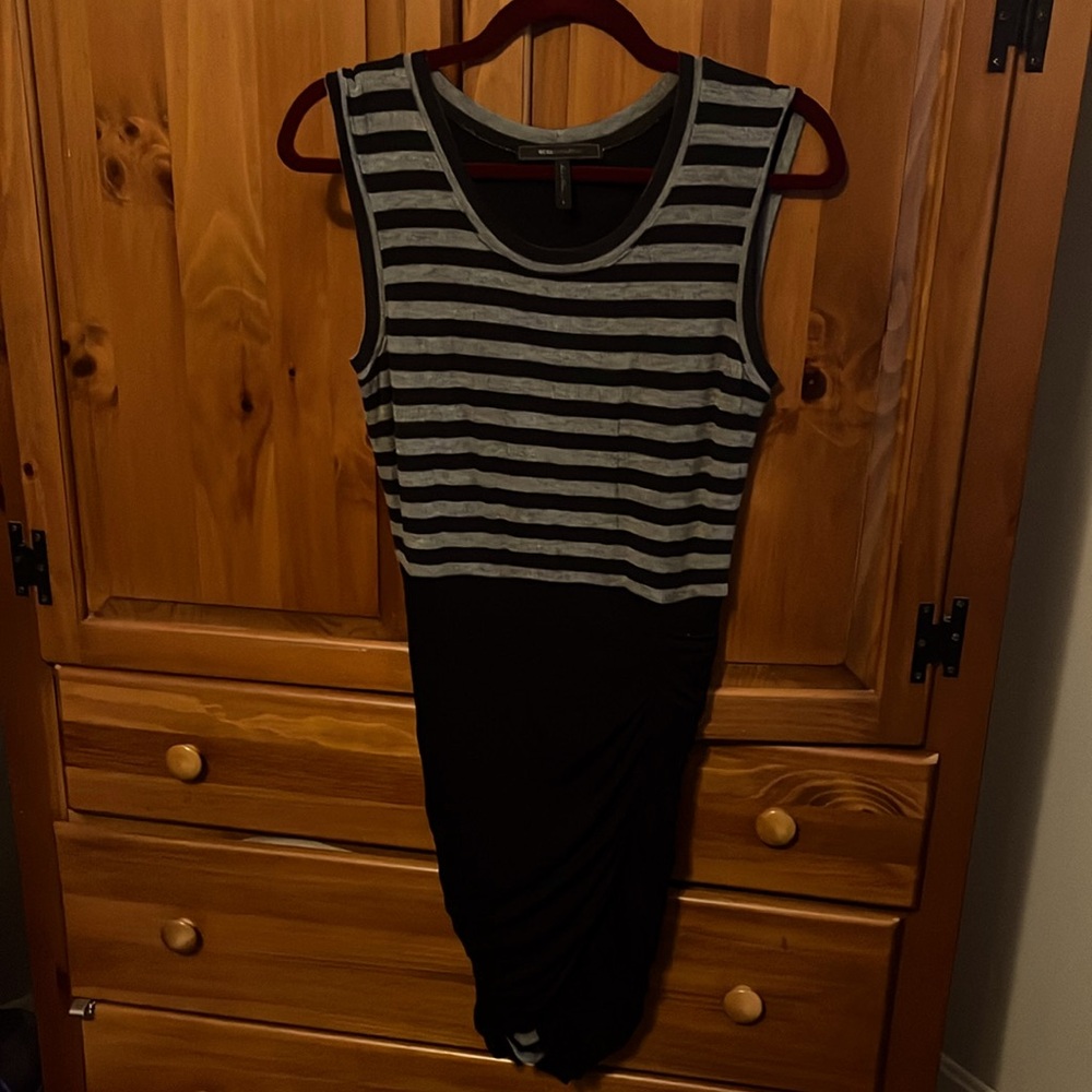 Super spicy ruched dress by BCBGMaxAzria. This dress is perfect for a night out.